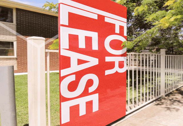 For lease sign in a suburban street.