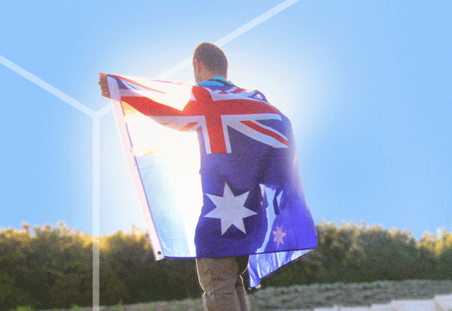 Man with flag draped over his shoulders.