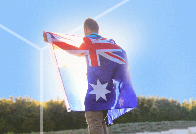 Man with Australian flag draped around him.