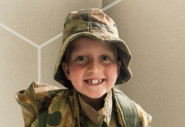 Young boy in cadet gear.